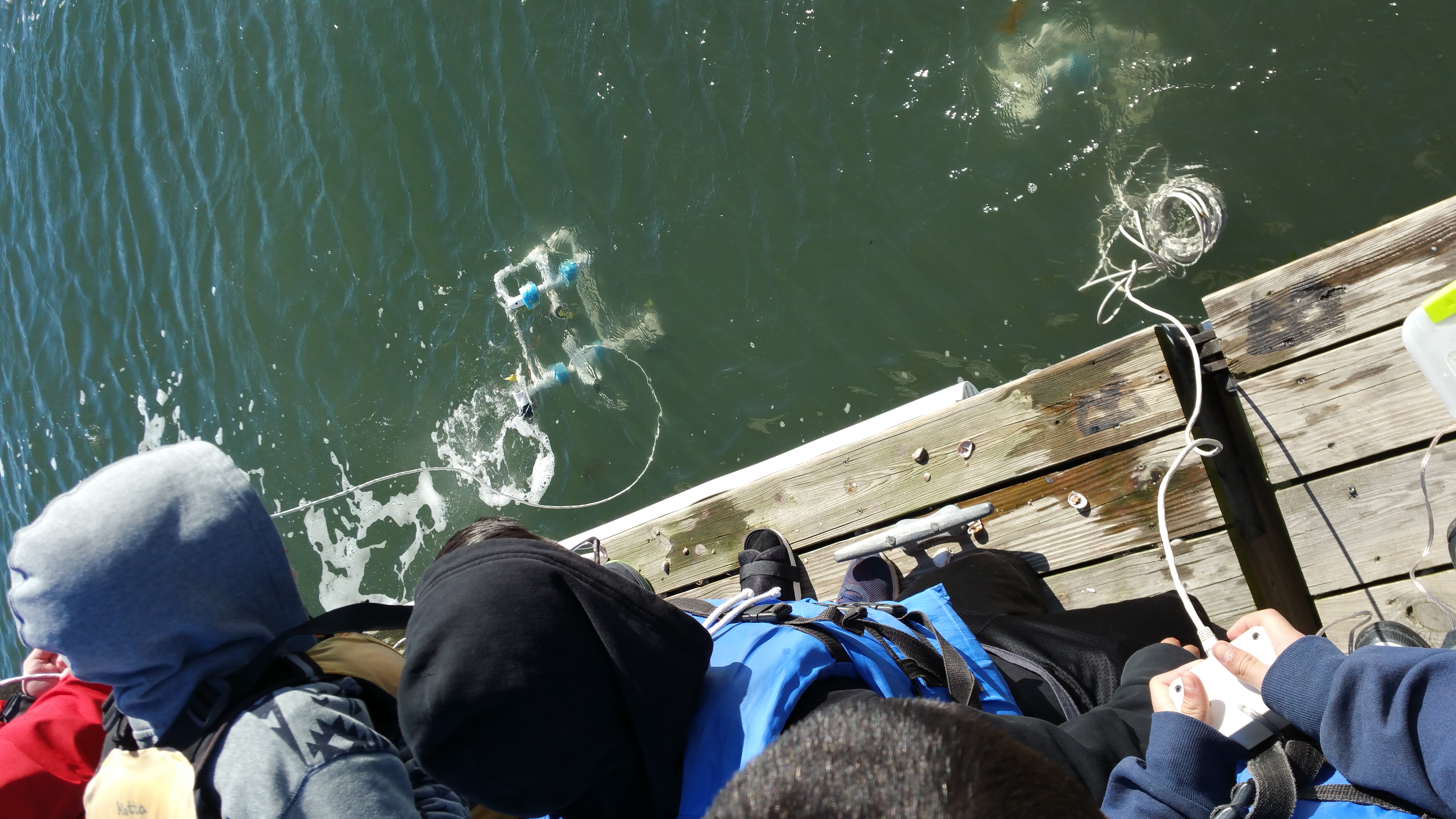 Students testing their ROVs off the dock