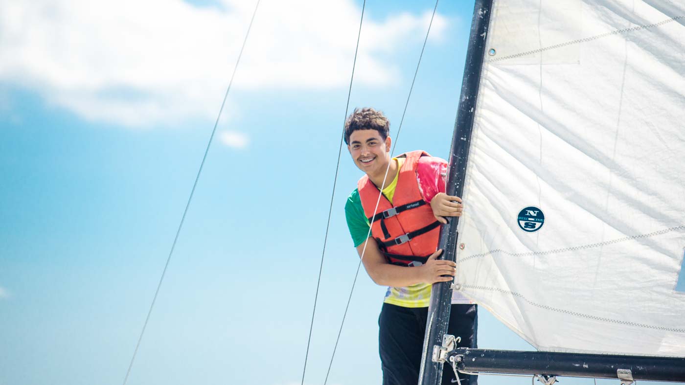 Student looking around the mast of a Sonar