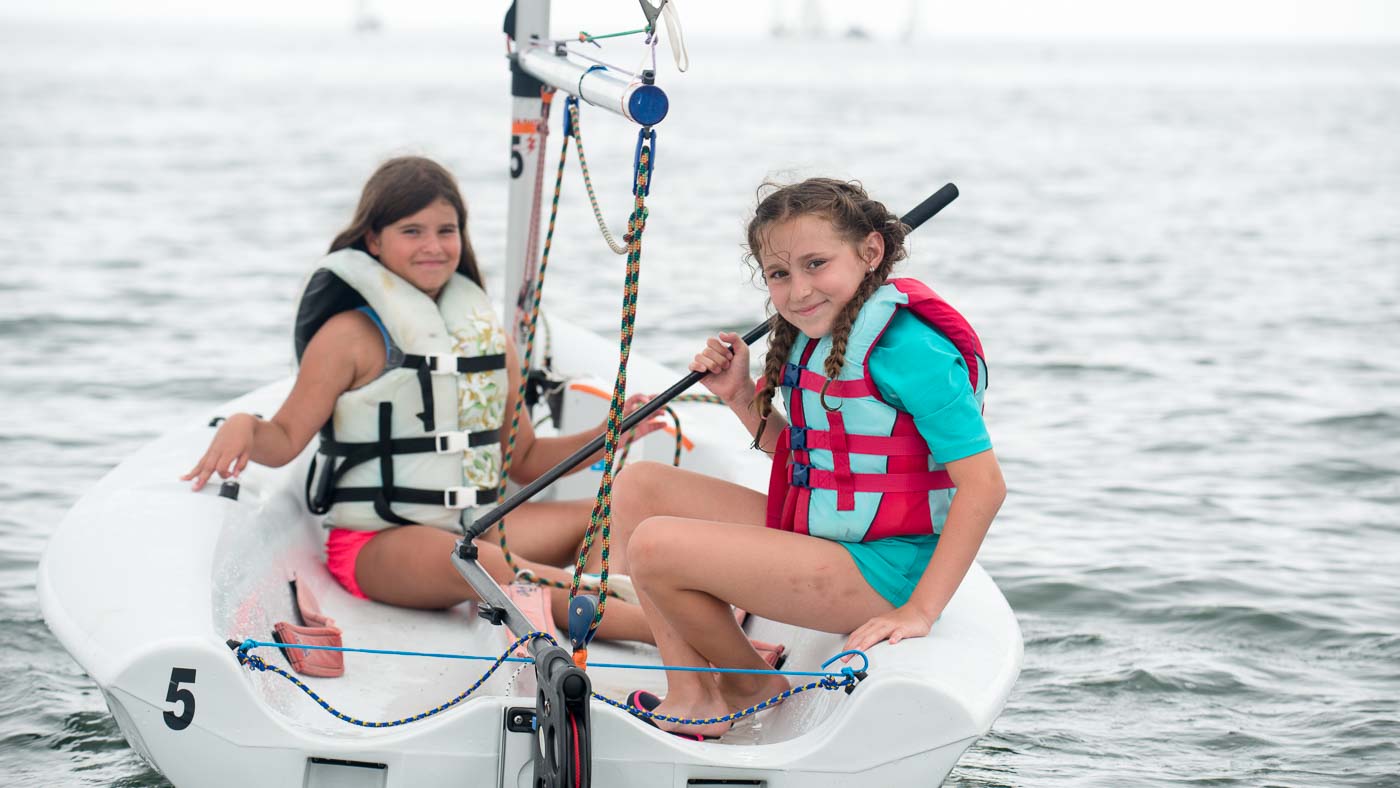 Campers sailing a Pico