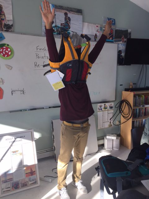 Instructor taking off life jacket