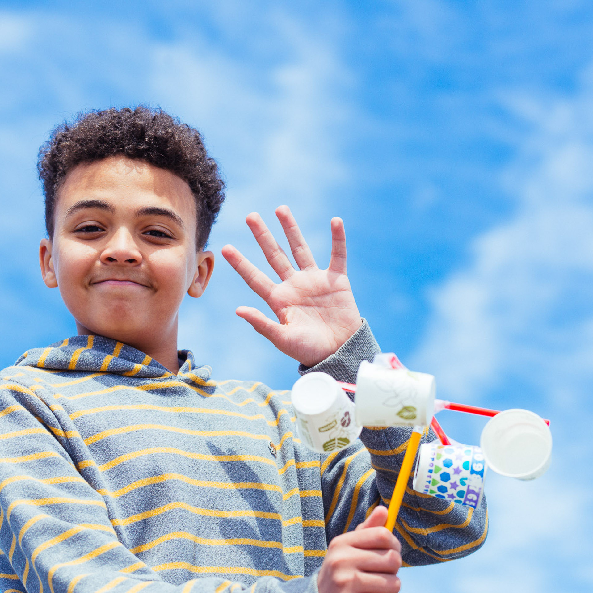 Student with an anemometer we built