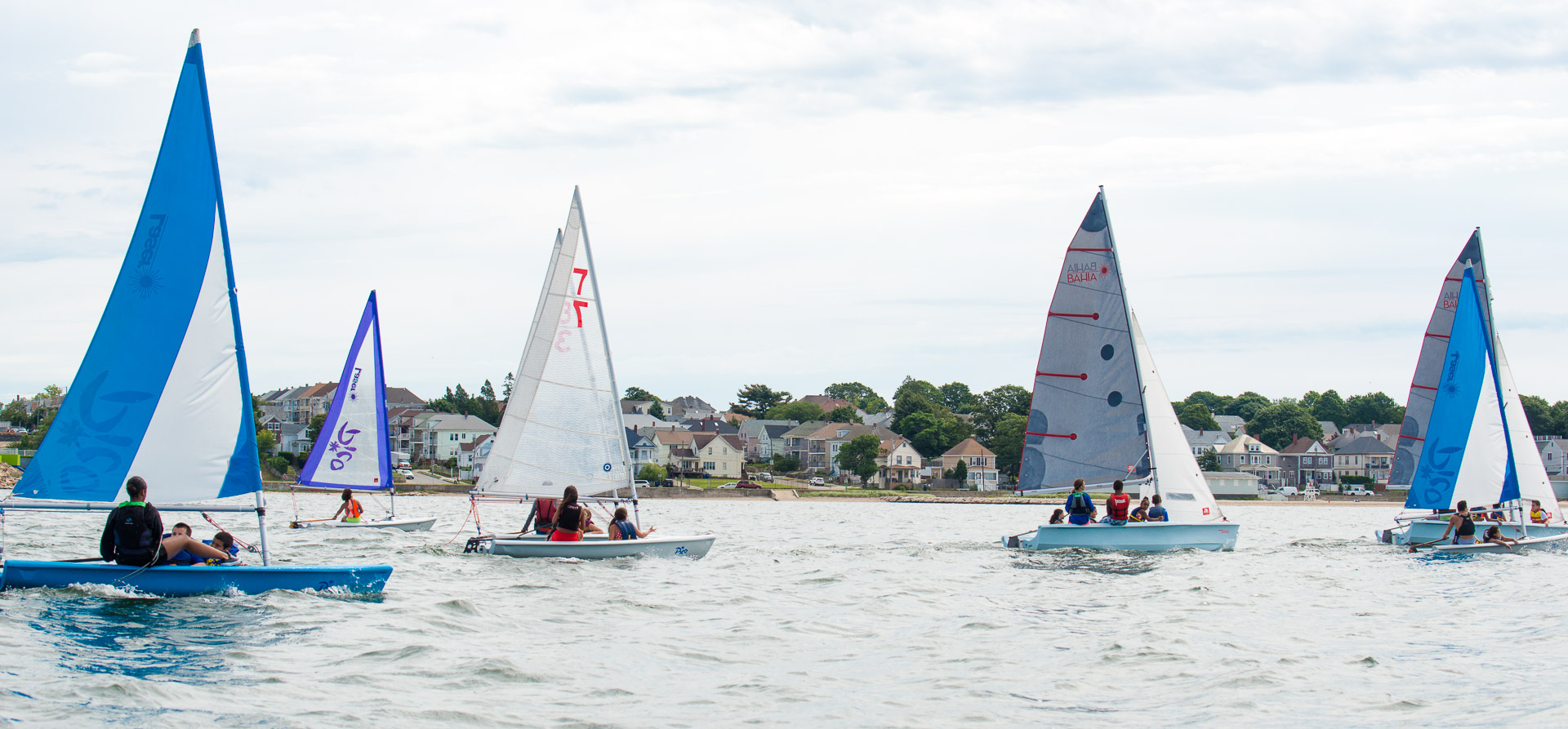 Fleet of picos and bahias sailing