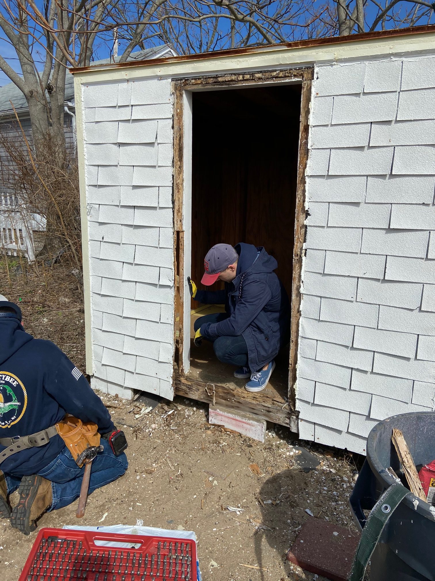 Fixing the door to the shed at cbc