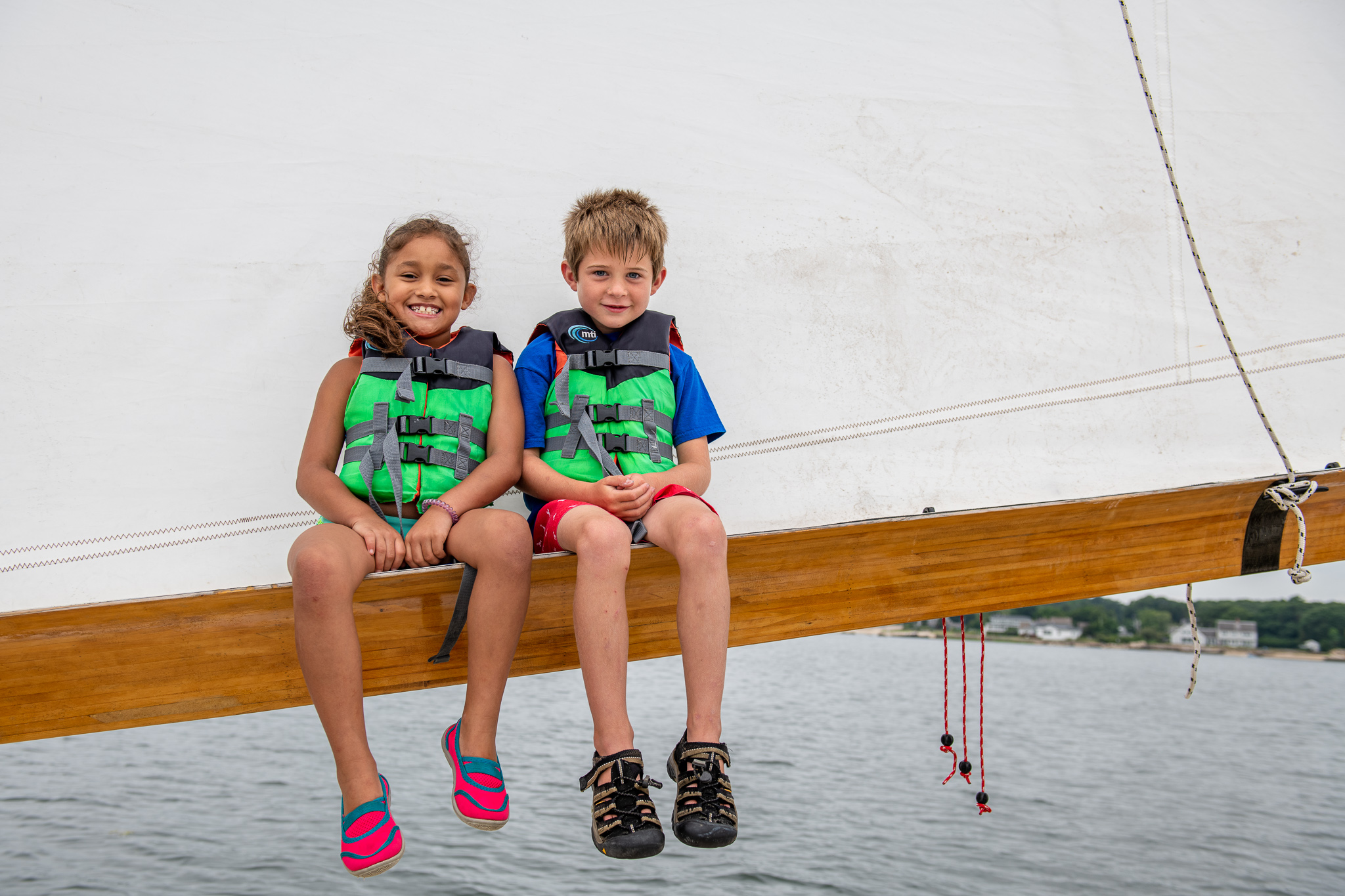 Students sitting on a boom