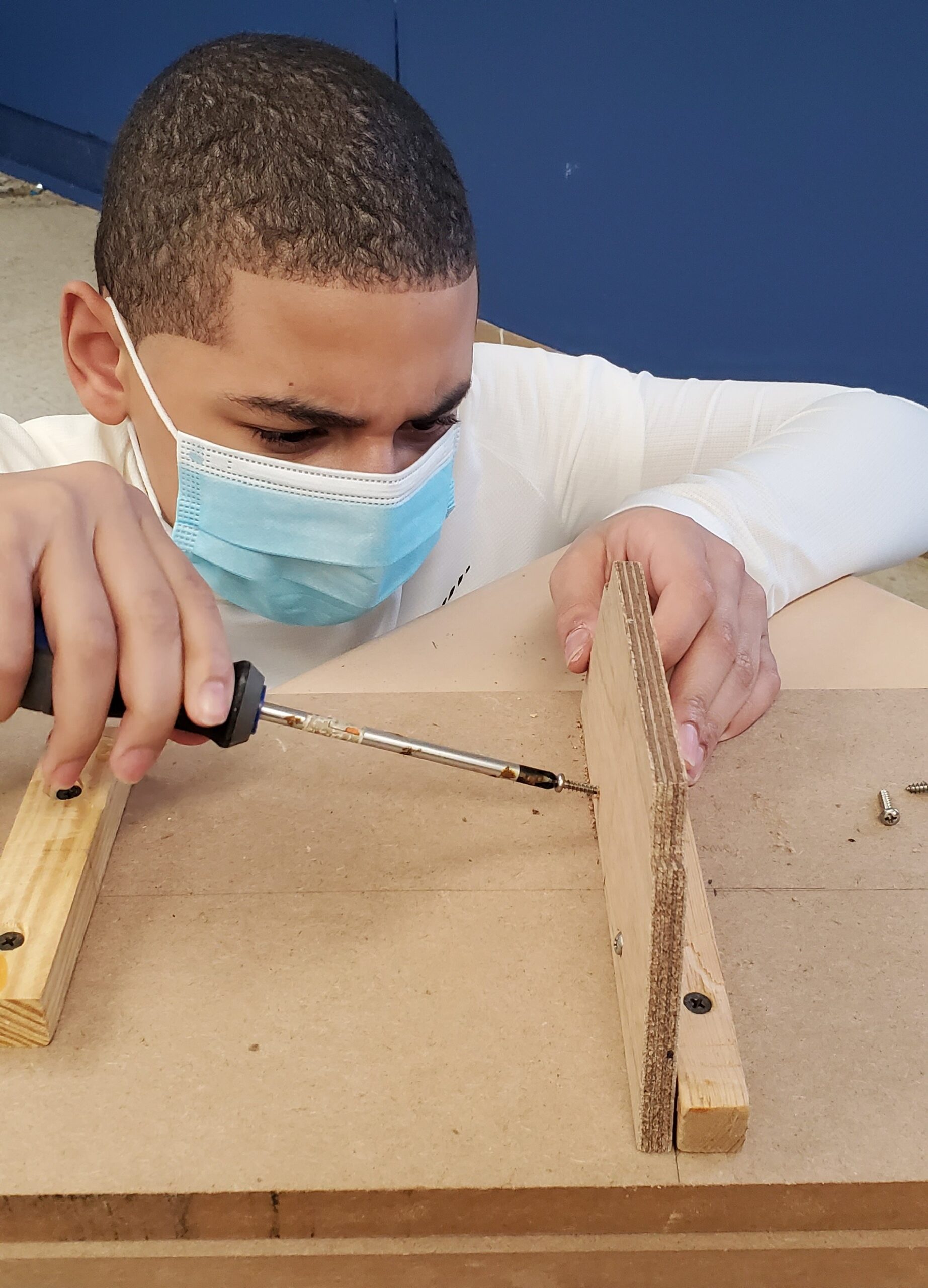 Student attaching a center frame