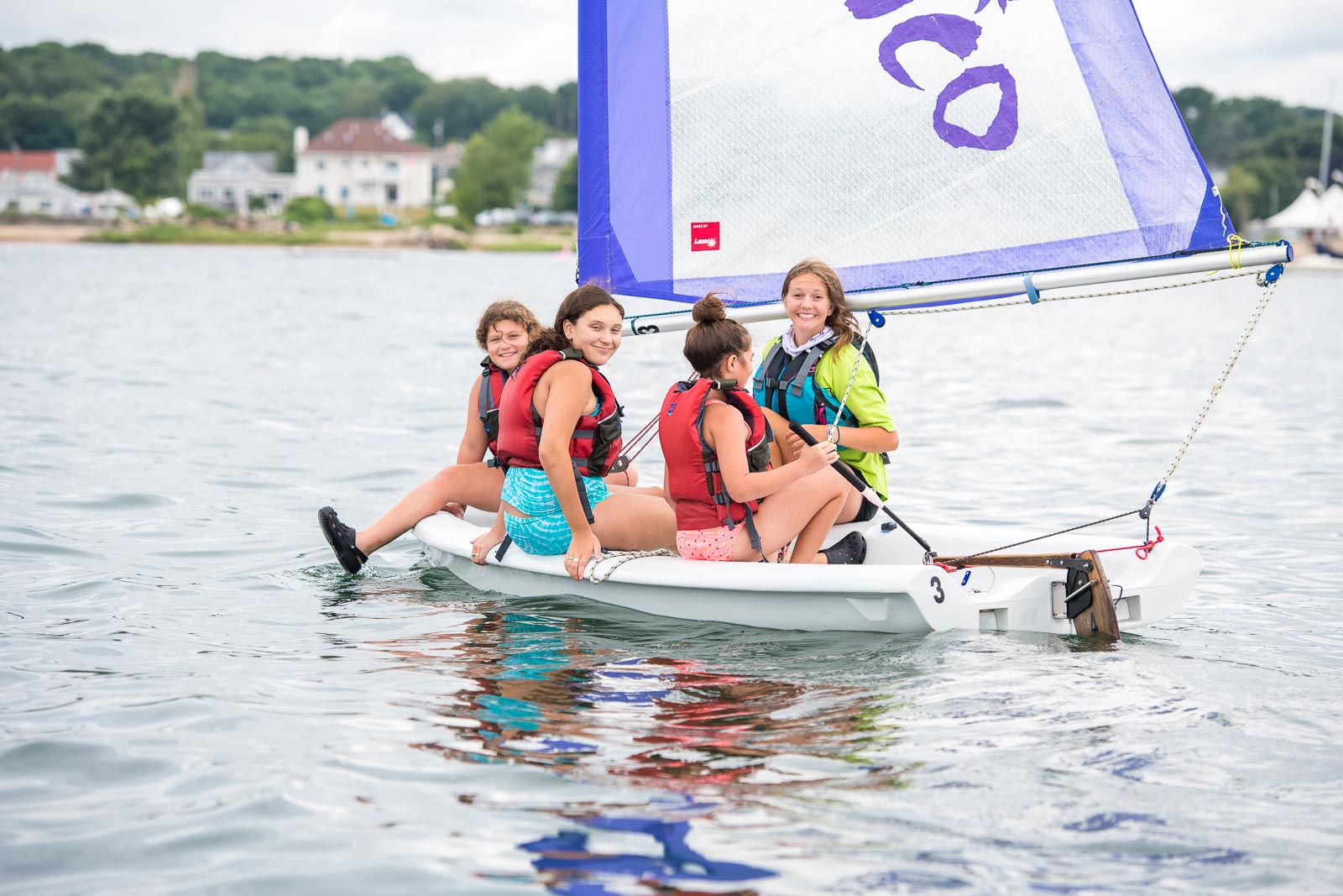 kids sailing on a pico, having fun.