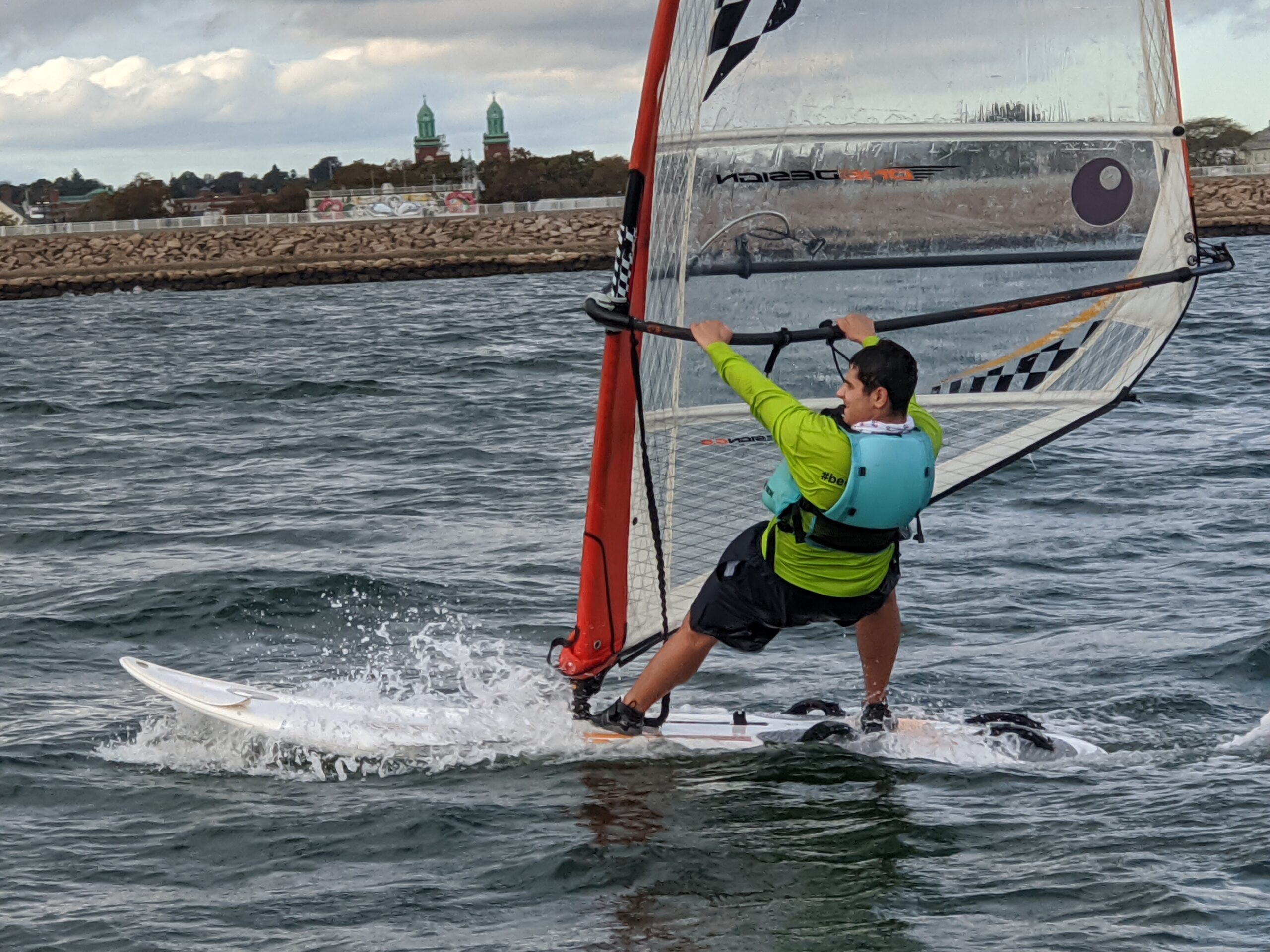 Iinstructor sailing windsurfer